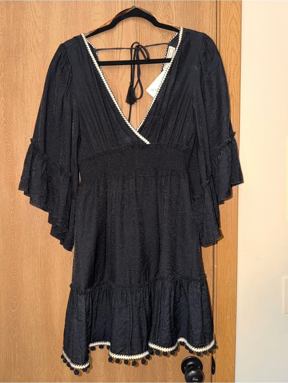 Flying Tomato Black V‑Neck Tiered Mini Dress with Pom Trim